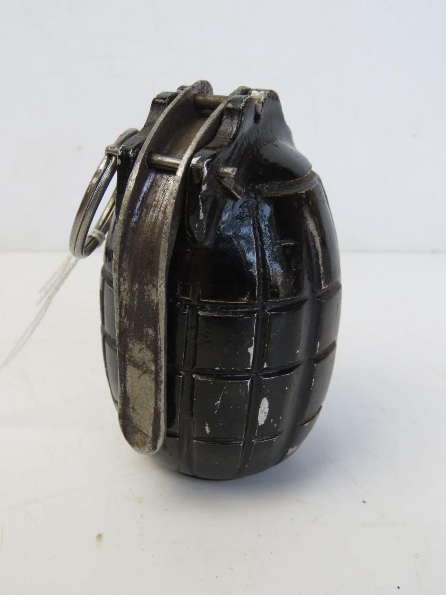 An inert WWI British No.5 Mills grenade, dated 1916 to base.