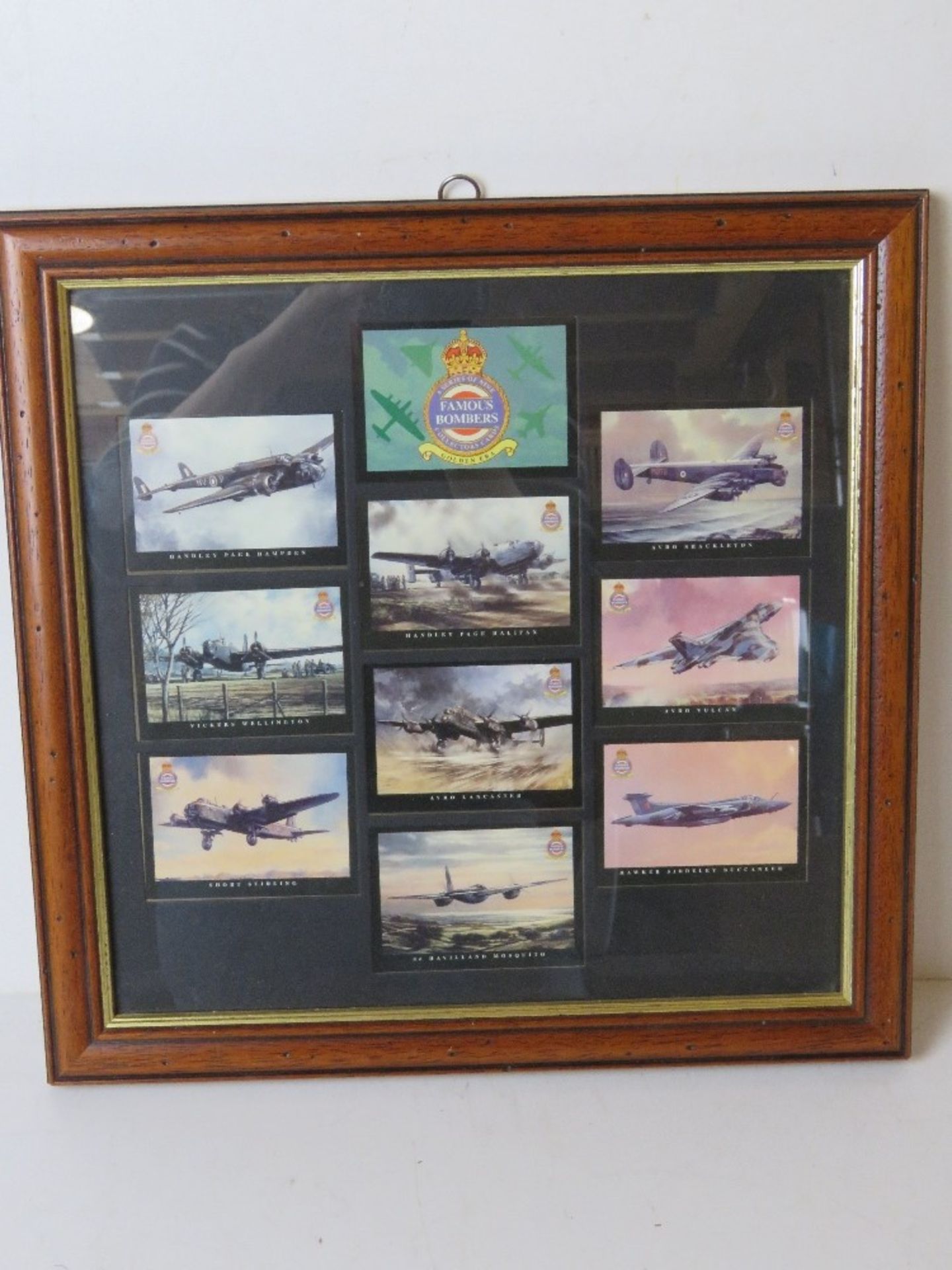 A framed set of Military themed 'Famous Bombers' cigarette cards.