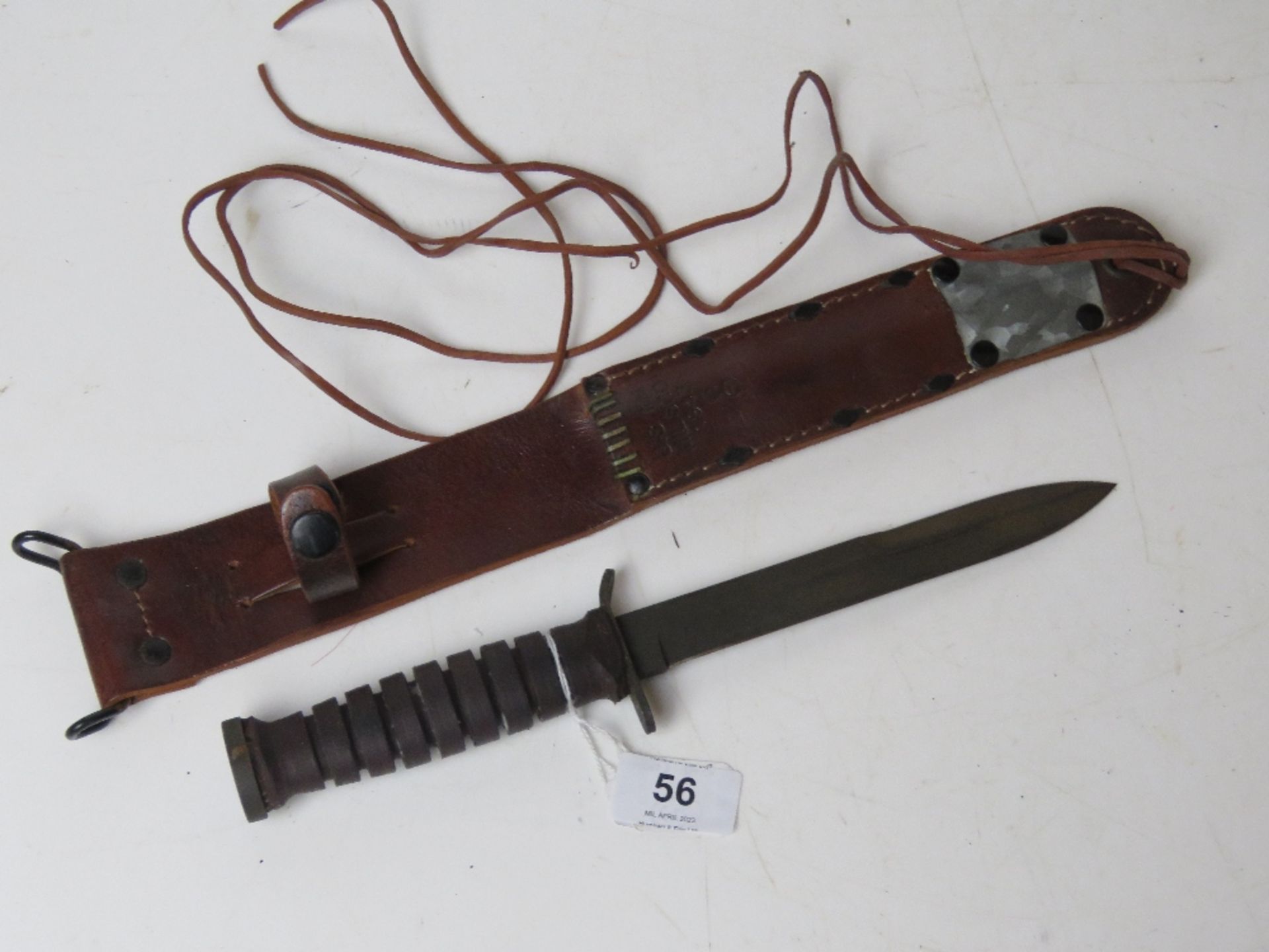 A reproduction M6 fighting knife with scabbard, dated 43 on the scabbard.