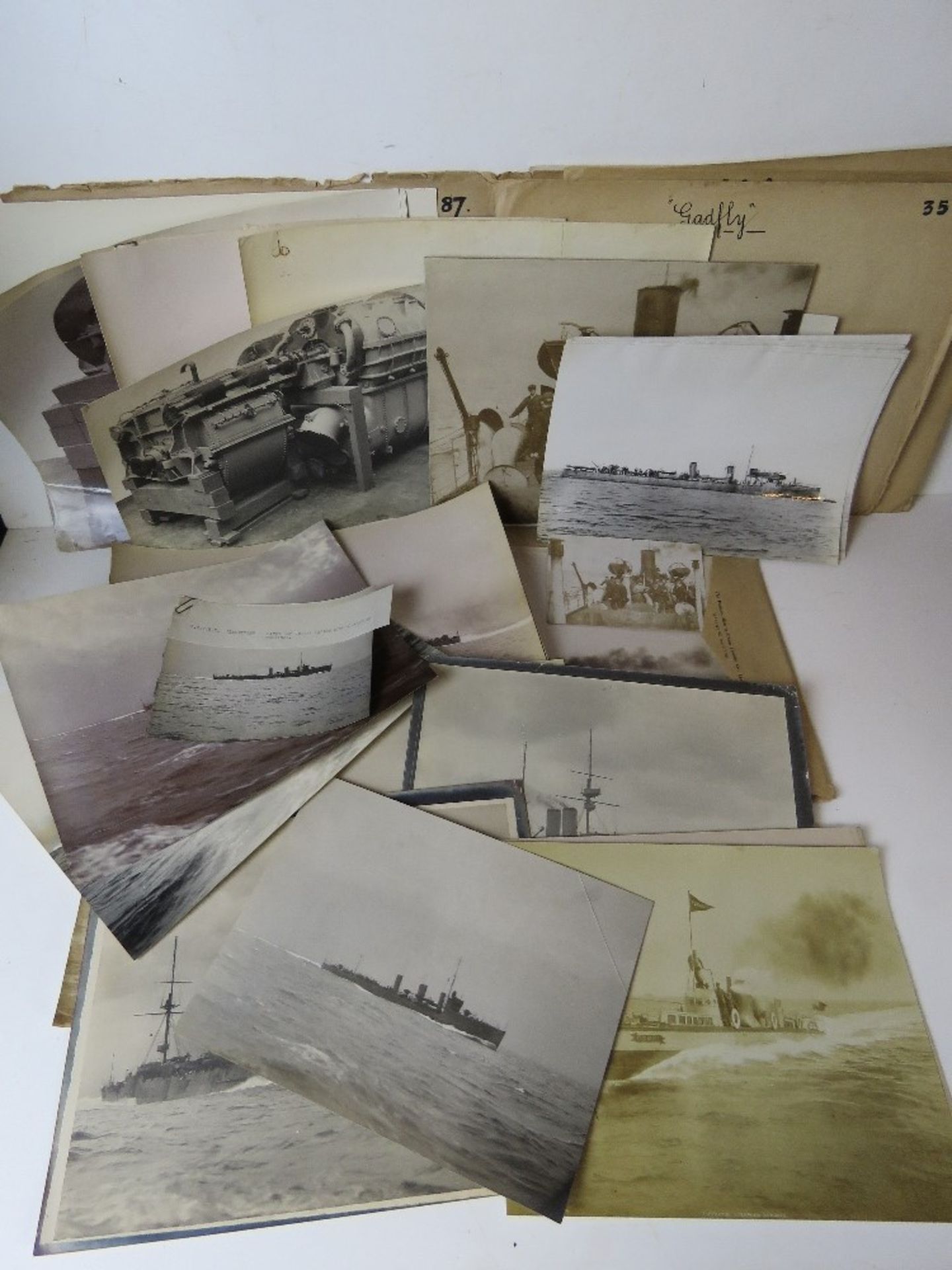 A quantity of assorted military ship photographic prints, blueprints, etc.