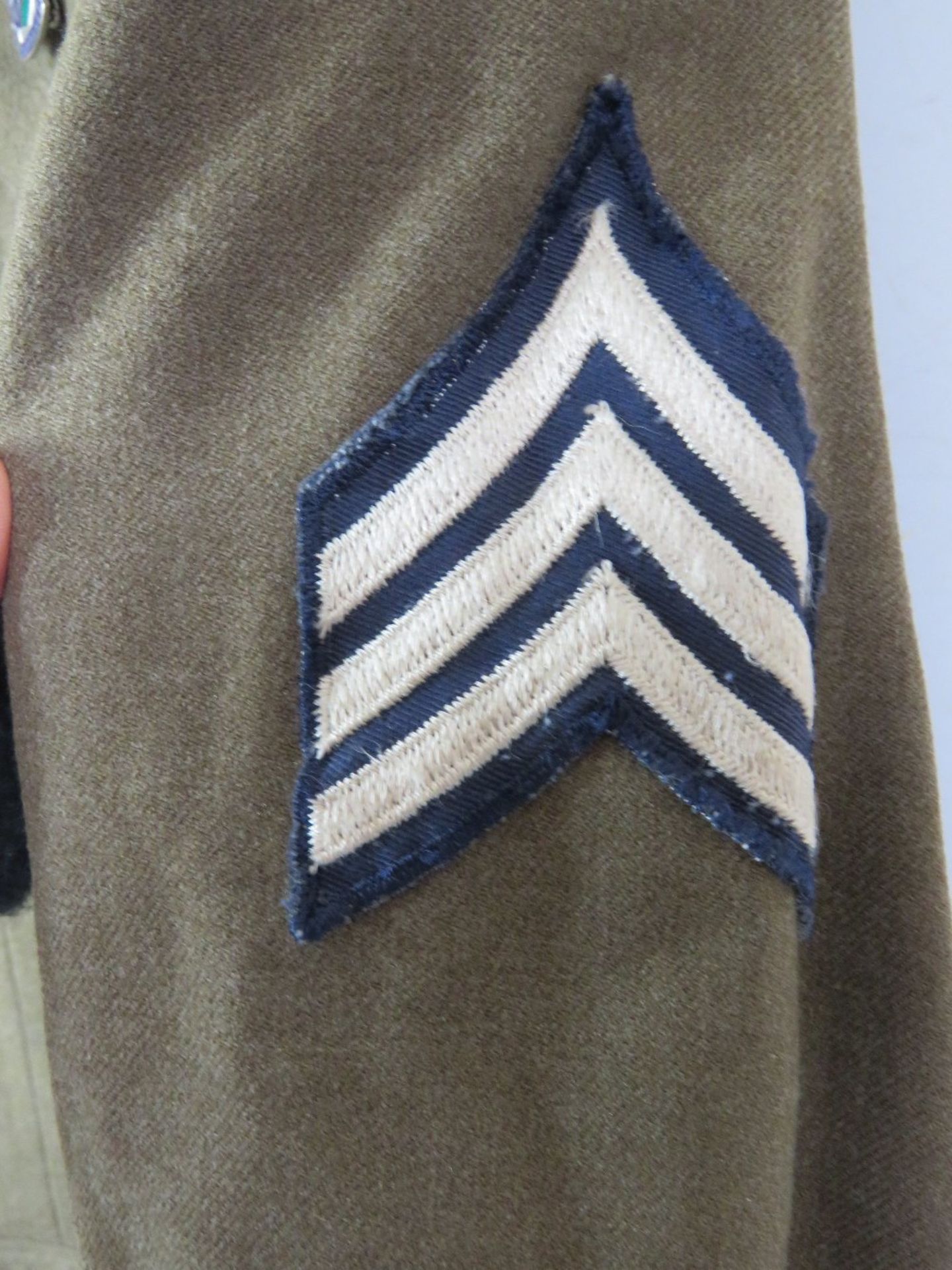 A WWII US Airborne tunic, having all buttons and numerous patches and badges. - Image 3 of 8