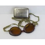 A pair of SOE Mk 1 Jump goggles with strap in original tin, with cleaning instructions.
