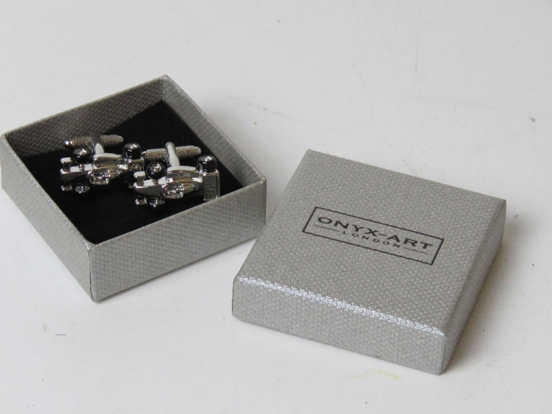 A pair of as new cufflinks in the form o