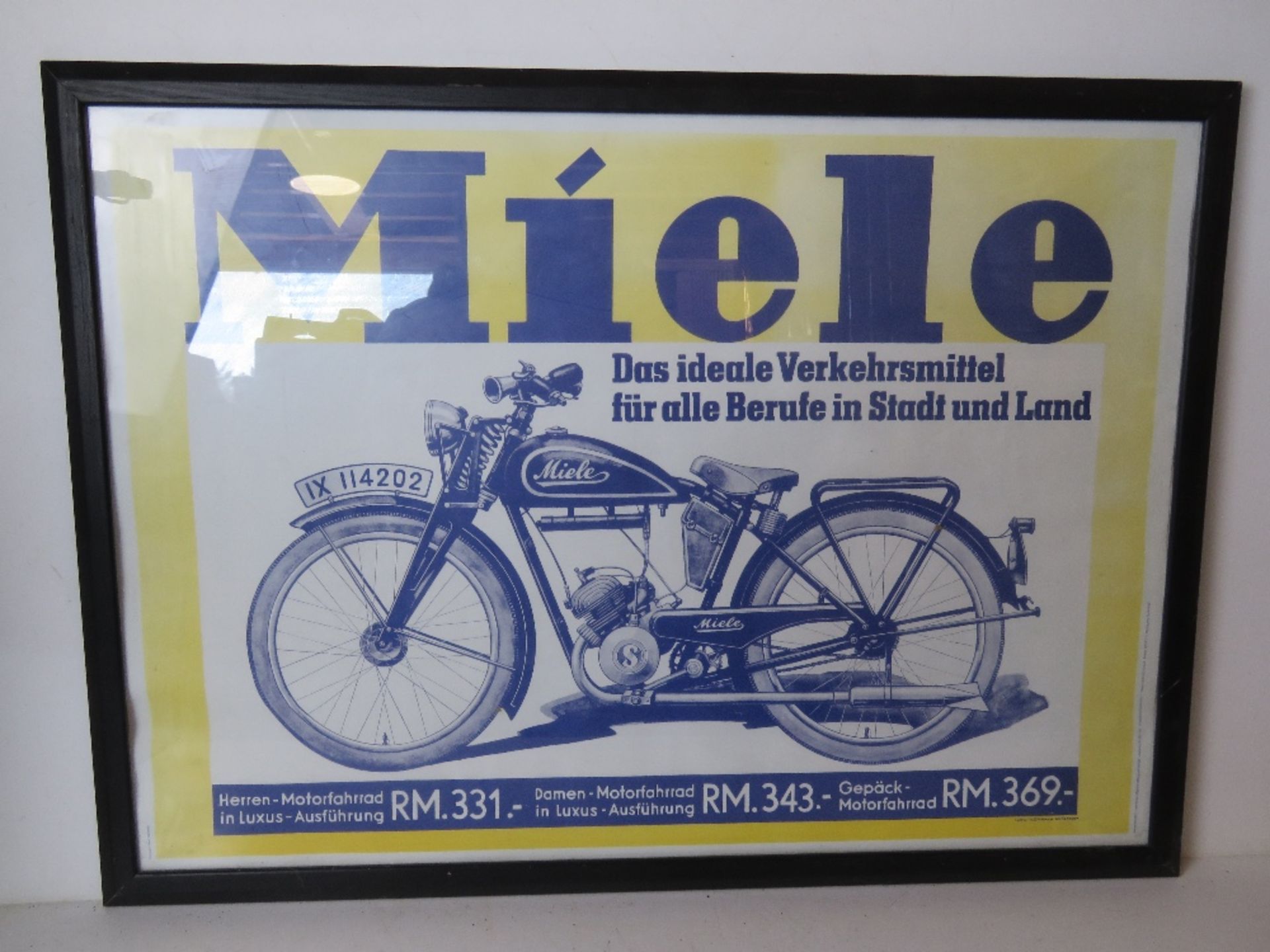 A Miele poster print in frame dated 1989