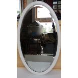 An oval wall hanging mirror in white painted wooden frame, overall 73 x 45cm.