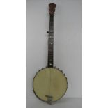 A banjo in need or re-stringing having delightful mother-of-pearl inlaid decoration to neck.