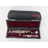 A piccolo by Just Flutes within fitted case and outer case