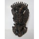 An Indo-Asian carved hardwood deity figurine, a/f, standing approx 35cm high.