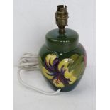 A Moorcroft table lamp in the form of a ginger jar,