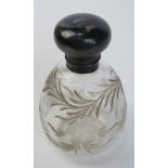 A hallmarked silver and cut glass perfume bottle, HM for London and having floral pattern upon.