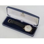 A 9ct gold Garrard Automatic wrist watch in original presentation box and on original Garrard strap,
