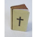 A pocket 'Book of Common Prayer' having hallmarked silver crucifix to front.