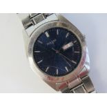 A stainless steel Pulsar wrist watch having blue dial with day and date apertures, V733-X070.