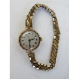 A ladies 9ct gold wrist watch on expanding bracelet,