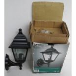 A contemporary outdoor wall light in original box.