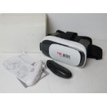 A VR box Virtual Reality headset and controllers.