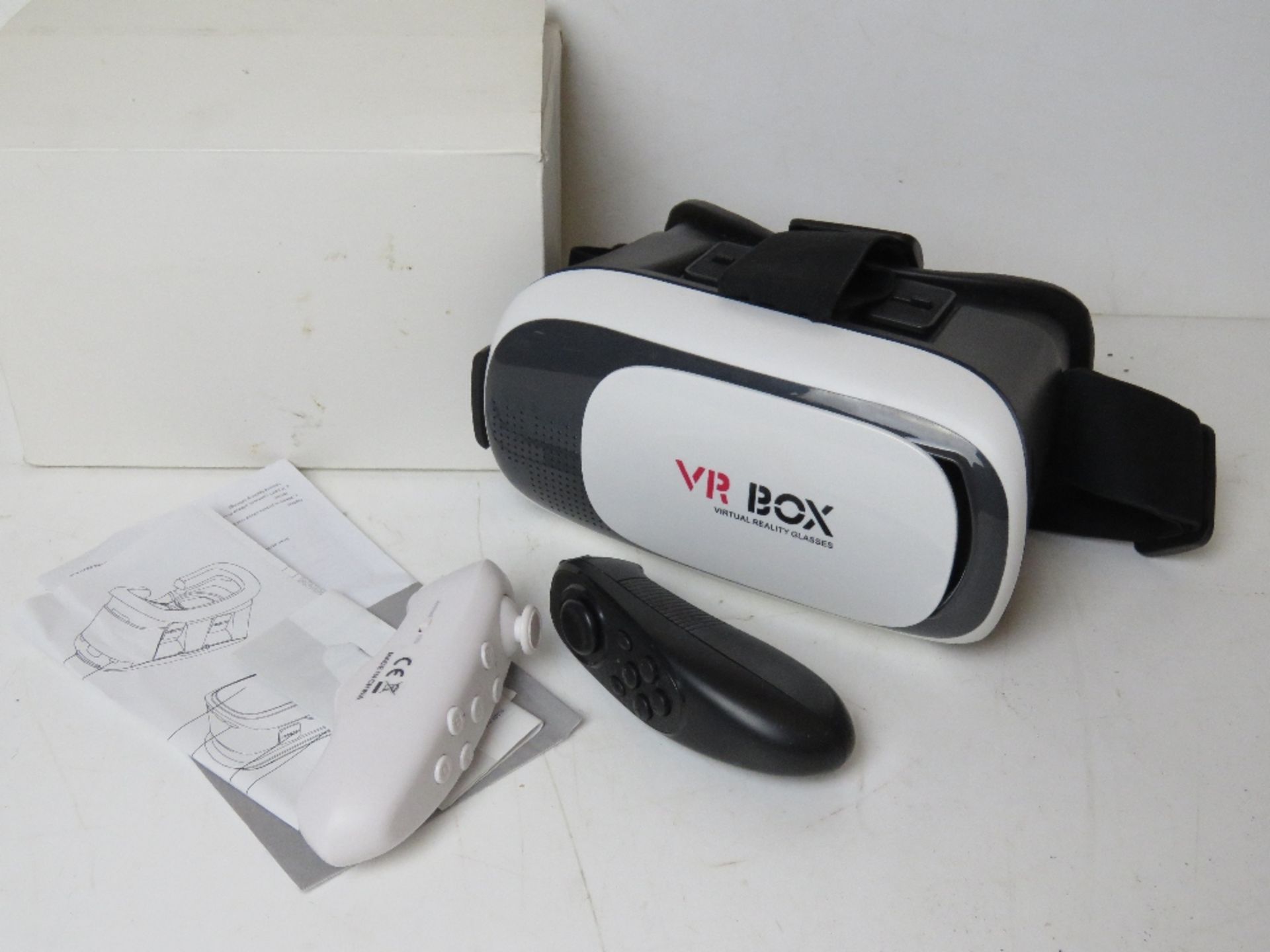 A VR box Virtual Reality headset and controllers.