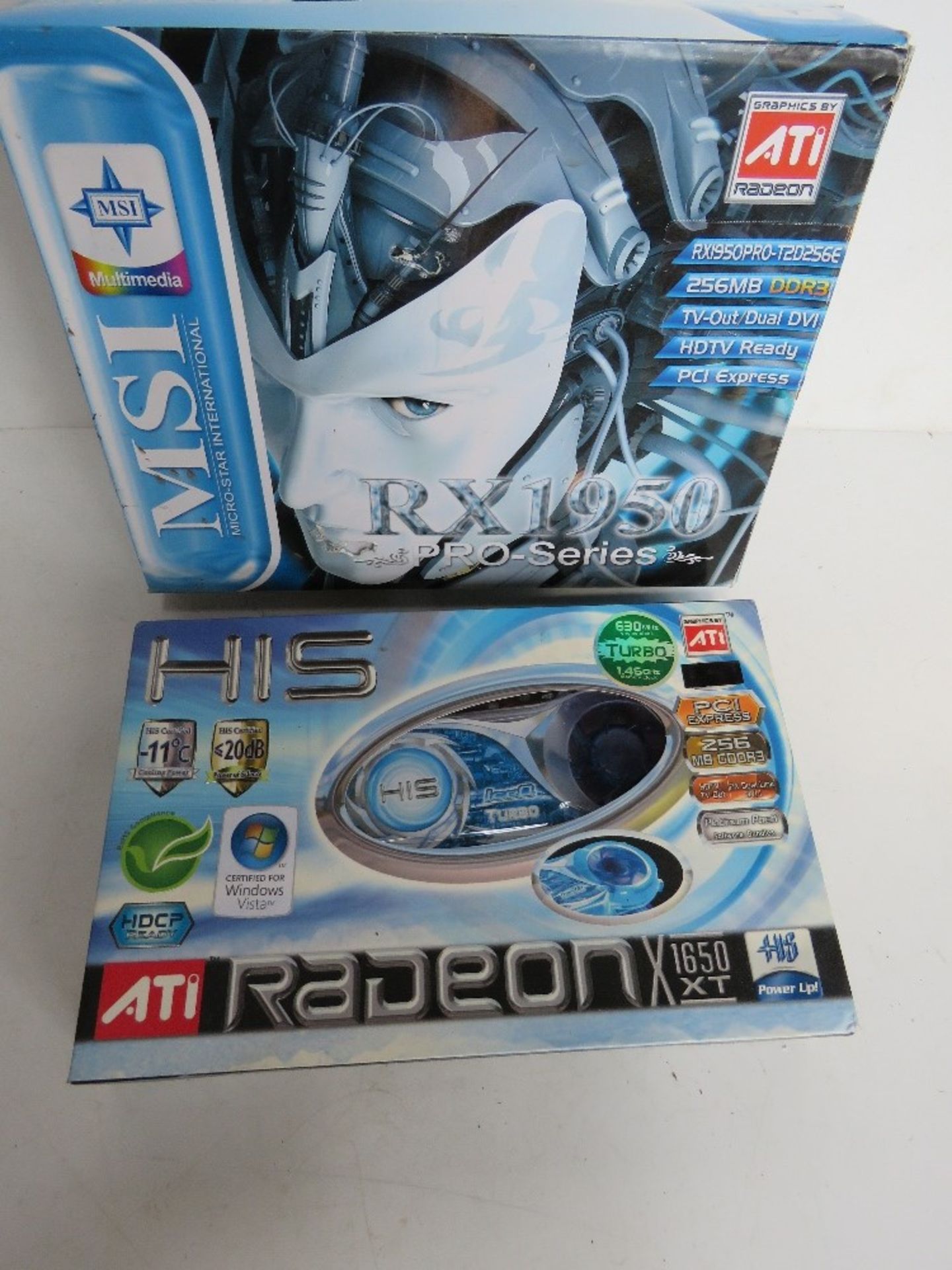 A boxed graphics card and mother board.