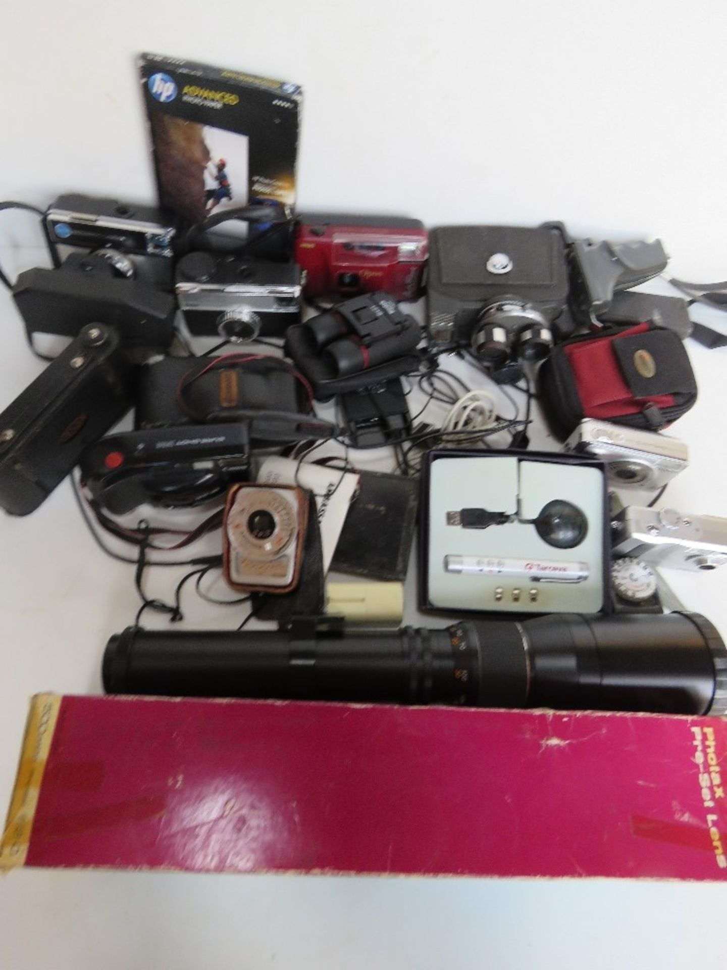 A quantity of assorted cameras and associated items inc Kodak Instamatic cameras, Canon Sure Shot,