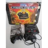 A Sega Megadrive II in Disney Lion King themed box with instructions,