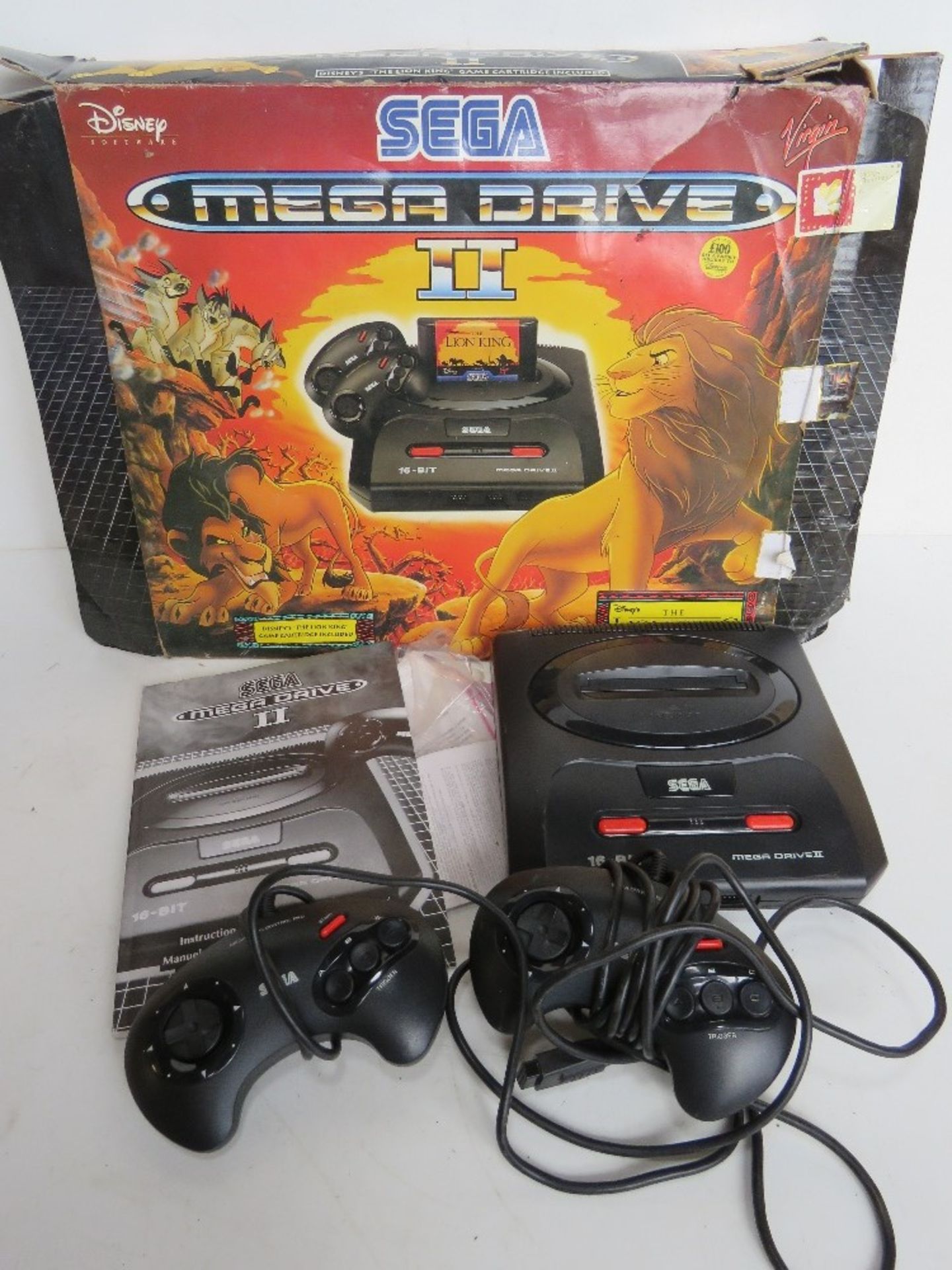 A Sega Megadrive II in Disney Lion King themed box with instructions,