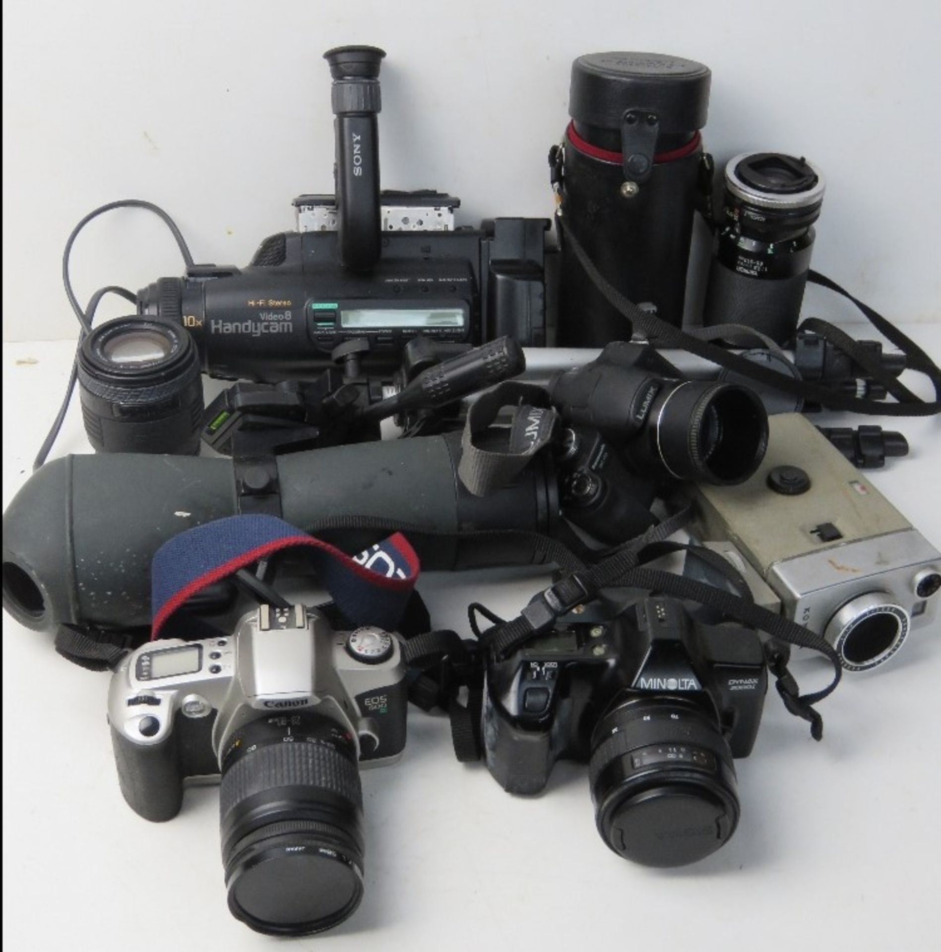 A quantity of cameras and equipment inc Tamron Lens, Panasonic Lumix, Minolta Dymax, Canon E05,