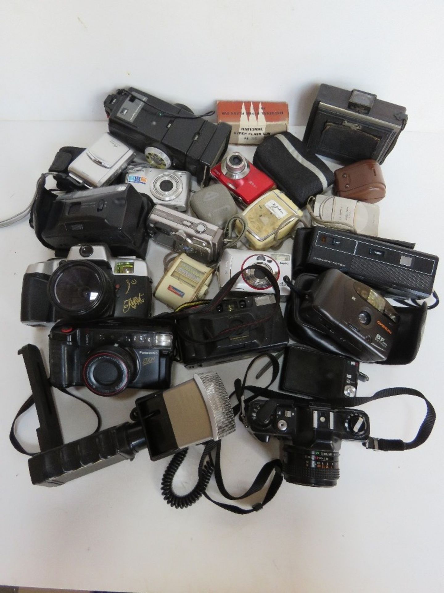 A quantity of assorted cameras and accessories inc Konica TC-X, Chinon, Flashmatic, etc.