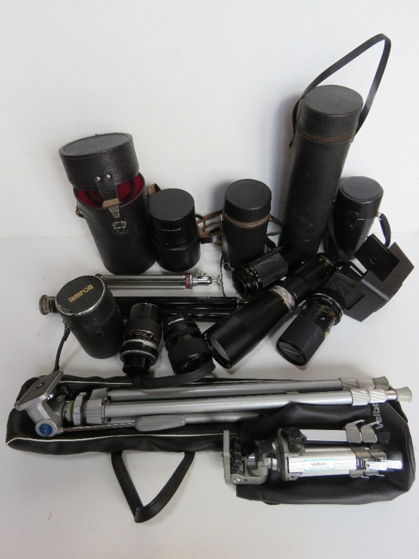 A quantity of photographic equipment inc lenses and tripod, Tamron lenses noted.