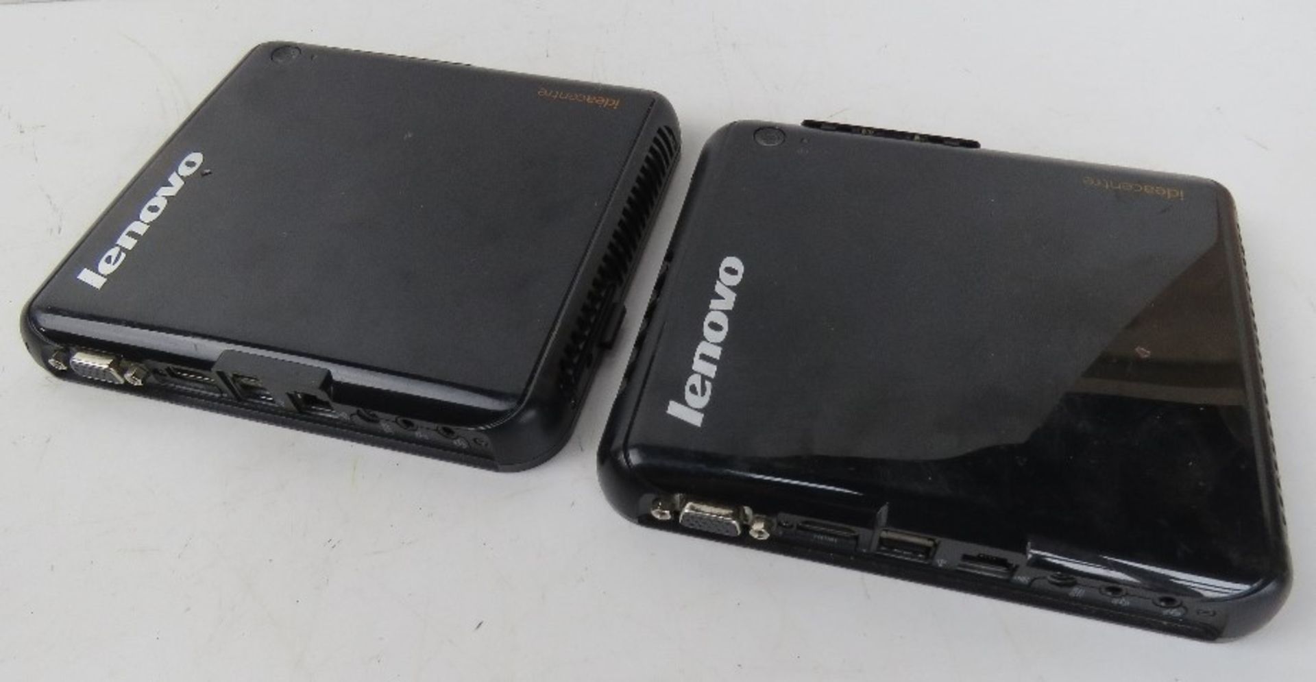 Two Lenovo Ideacentre computers.