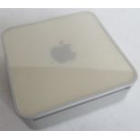 An Apple Mac mini. No cables.