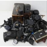 A quantity of assorted cameras and accessories inc Brownie Junior No2, Canon Zenit, etc.