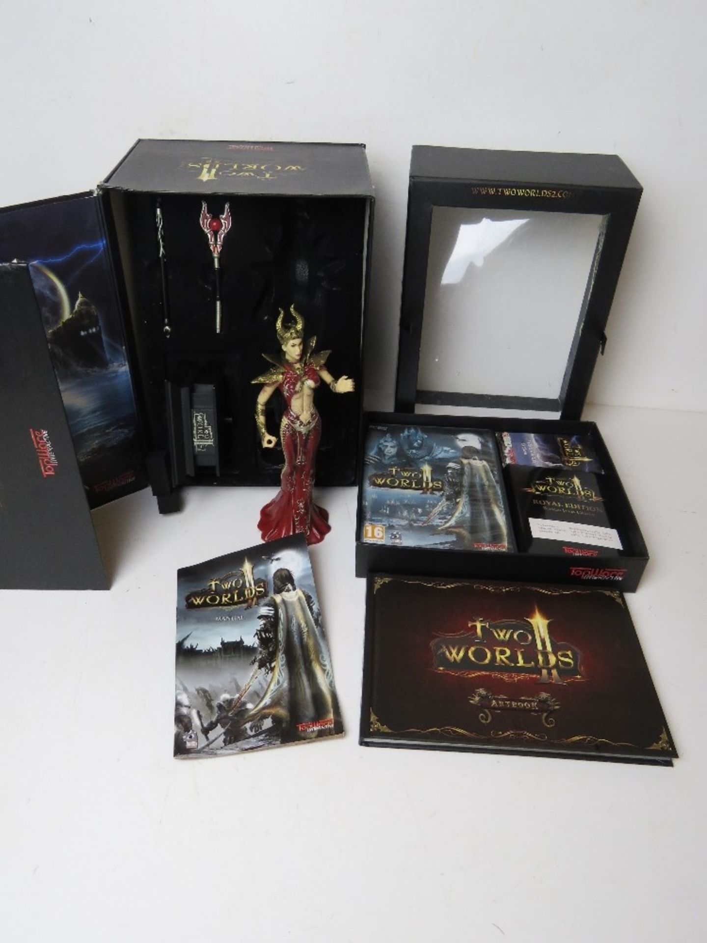 A Two Worlds II Topware Interactive game with artbook at figurine in 'Royal Edition' box. Box a/f.