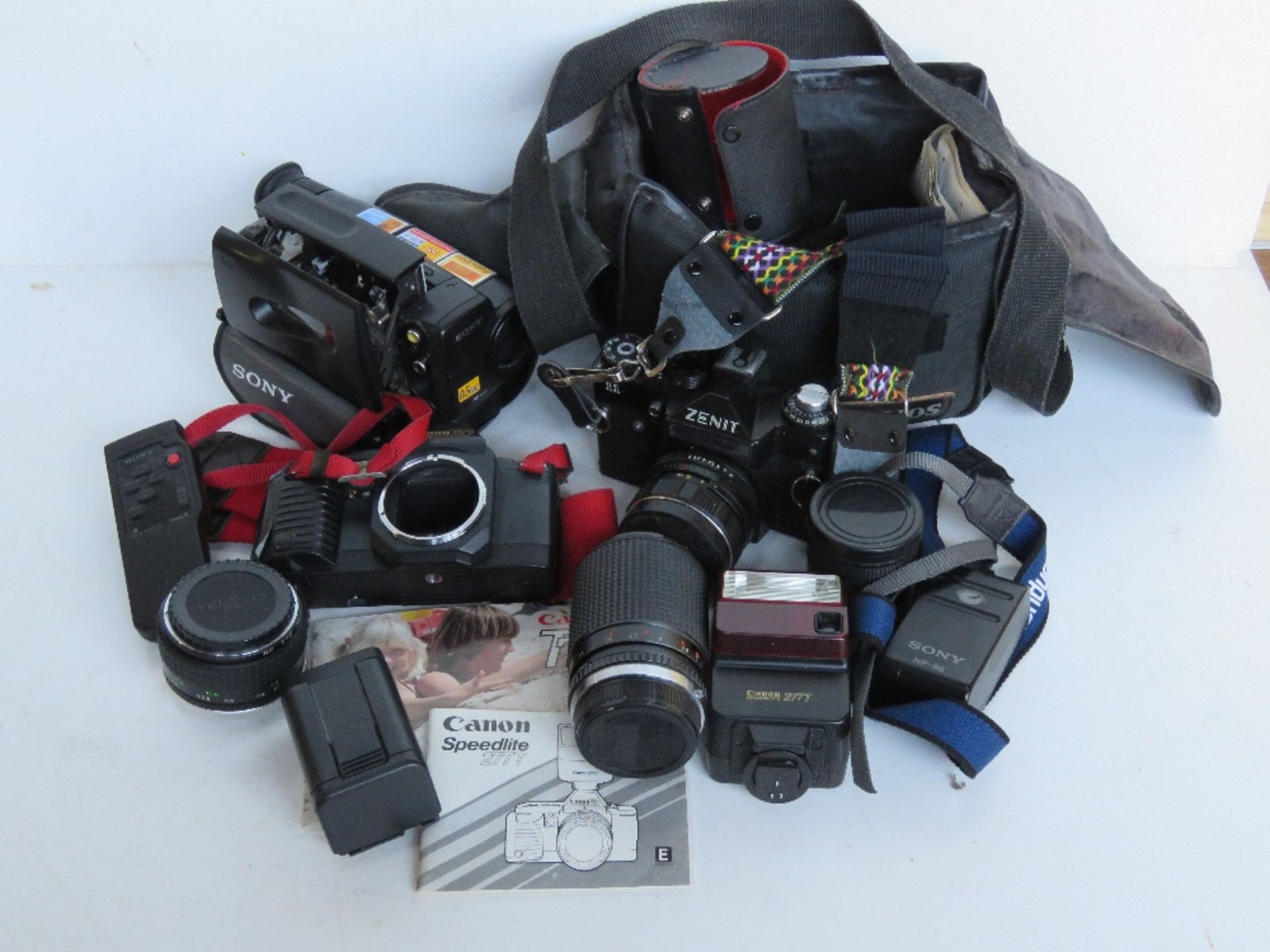 A quantity of cameras and equipment inc Zenit, Sony Camcorder, Canon Speedlite flash,