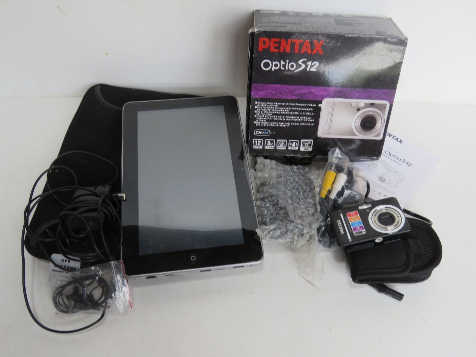 A Pentax Optio S12 in box, together with a A1CS Tablet with cable. Two items.