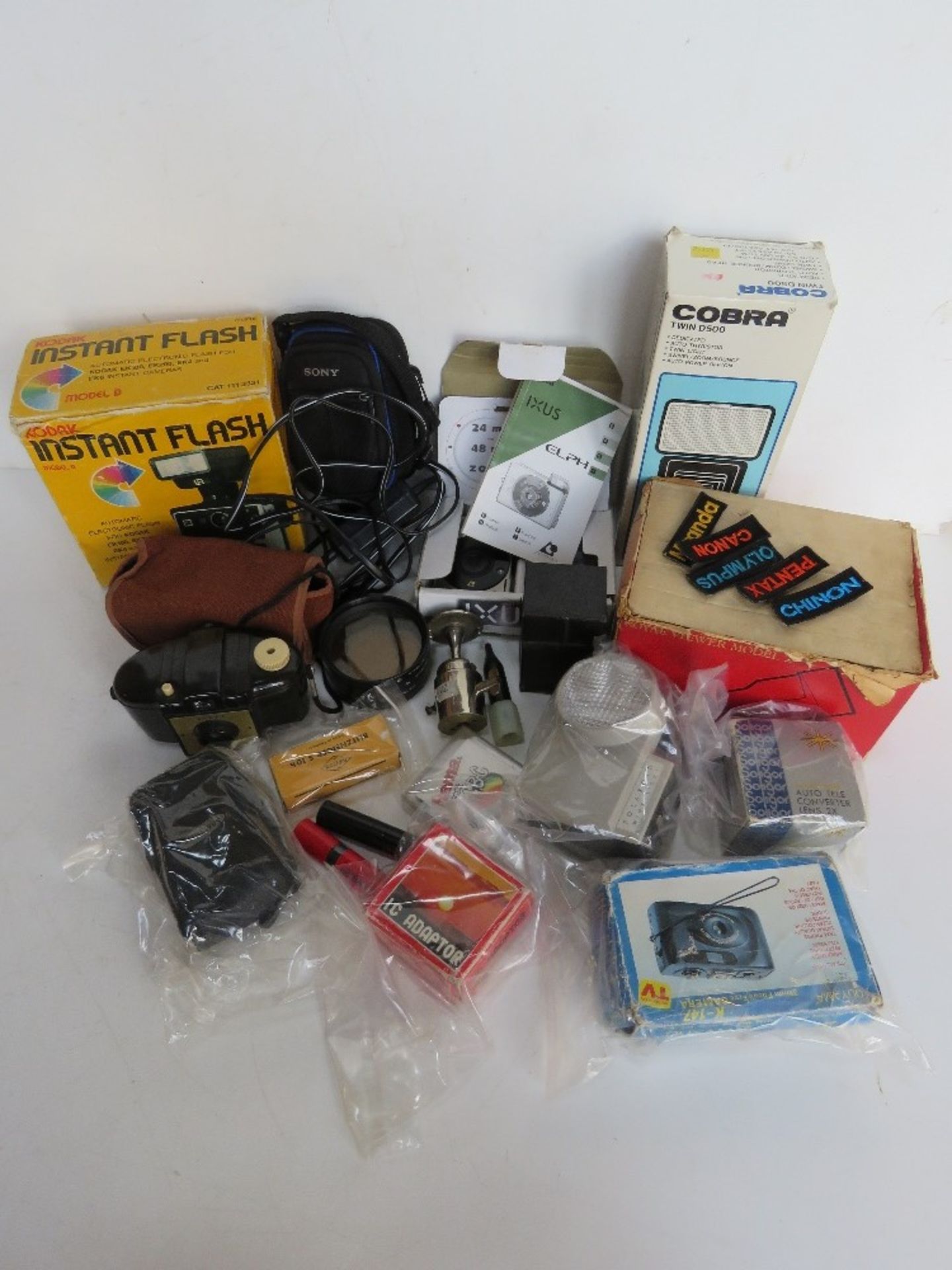 A quantity of assorted cameras and accessories inc Kodak Brownie 127, Polaroid Wink-Light,