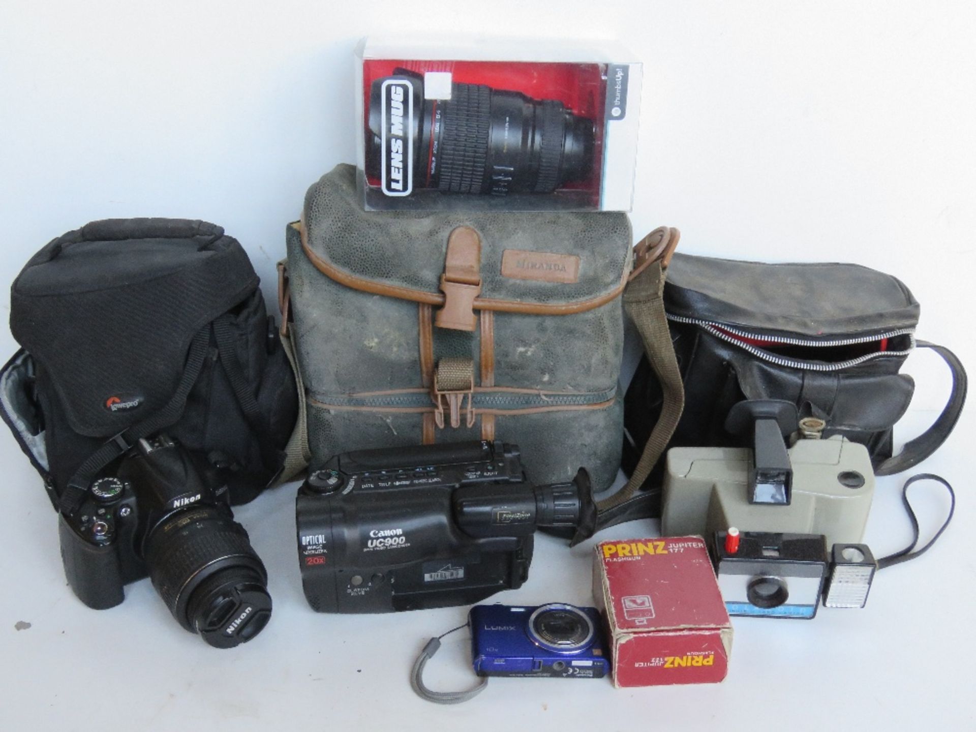 A quantity of cameras and camera equipment inc Canon Camcorder, Nikon, Prinz Flashgun,