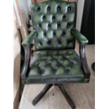 A green Chesterfield type office chair for refurbishment (damage to base, castors deficient).