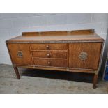 A delightful early 20th century oak dresser having silver painted floral carving throughout,