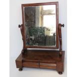An early 20thC dressing table mirror having jewellery drawers under, approx 43cm wide.