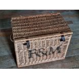 A Fortnum and Masons wicker hamper having end handles.