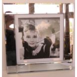 Audrey Hepburn print in mirrored glass frame, overall 54.5 x 54.5cm.