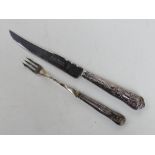 A hallamrked silver handled cake knife together with HM silver handled pickle fork.