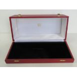 Cartier; a red leatherette presentation box, contents deficient.