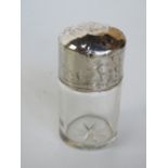 A hallmarked silver and cut glass dressing table bottle, with stopper.