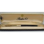A Parker '61' custom fountain pen, black with gold filled cap, in box, c.1975.