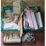 Two crates of dolls house making and decorating items including bricks, grass sheets, wallpaper,