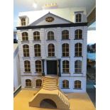 A superb decorated and furnished 'Georgian Manor' dolls house including dining room with butler,