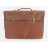 A vintage leather ladies briefcase havin