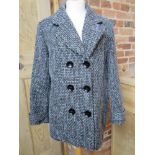 A ladies 2% wool coat size 18.