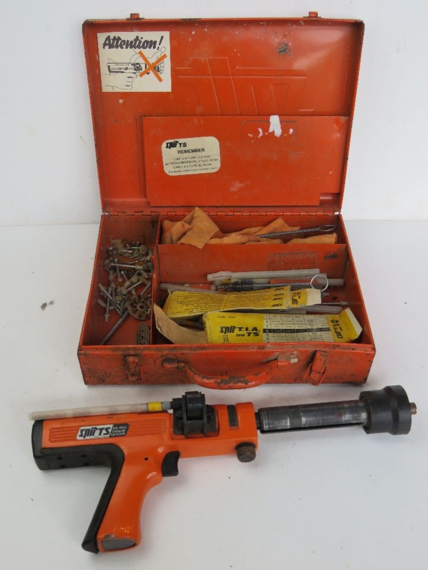 A Spit TS BE0145 powerful cartridge nail gun in box with accessories.